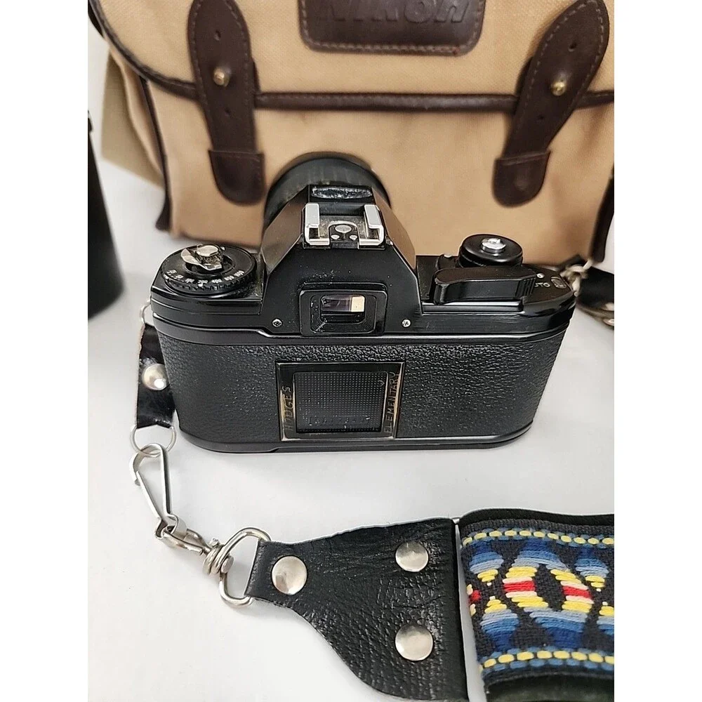 Nikon EM 35mm SLR Film Camera Black Body w/ Extra Lens, Bag & Accessorie